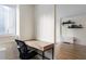 Bright home office featuring built-in desk, neutral walls, and hardwood floors in a naturally lit space at 215 Piedmont Ne Ave # 1109, Atlanta, GA 30308