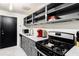 Modern kitchen with gray cabinets, stainless steel appliances, and a gas range at 215 Piedmont Ne Ave # 1109, Atlanta, GA 30308