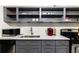 A kitchen featuring gray cabinets, open shelving, white marble countertops, and stainless steel appliances at 215 Piedmont Ne Ave # 1109, Atlanta, GA 30308