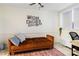 Living room featuring neutral walls, decorative wall hangings, sofa, and natural light from a nearby window at 215 Piedmont Ne Ave # 1109, Atlanta, GA 30308