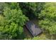 A wooded residential area features a single-story home and surrounding greenery at 2383 Edgewater Sw Dr, Atlanta, GA 30311