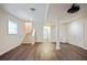 Finished basement space with wood-look floors, stairs, and a projector at 2383 Edgewater Sw Dr, Atlanta, GA 30311