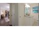 Bathroom has a double sink vanity with granite countertop and window at 2383 Edgewater Sw Dr, Atlanta, GA 30311