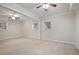 Spacious bedroom with neutral carpet, windows and ceiling fans at 2383 Edgewater Sw Dr, Atlanta, GA 30311