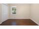 Clean, bright bedroom with hardwood floors, and minimalist design create a calming and open space at 2383 Edgewater Sw Dr, Atlanta, GA 30311