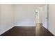 This bedroom features dark wood floors, neutral paint and bright white trim at 2383 Edgewater Sw Dr, Atlanta, GA 30311