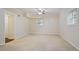 Bedroom with neutral carpet, ceiling fan, and natural light from two windows at 2383 Edgewater Sw Dr, Atlanta, GA 30311
