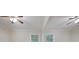 A bedroom offering two ceiling fans, neutral walls, carpet flooring, and windows at 2383 Edgewater Sw Dr, Atlanta, GA 30311
