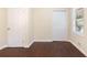 Bedroom features beautiful wood floors, base molding, and natural light from the window at 2383 Edgewater Sw Dr, Atlanta, GA 30311