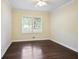 Bright bedroom featuring hardwood floors, crown moulding and a ceiling fan at 2383 Edgewater Sw Dr, Atlanta, GA 30311