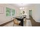 Elegant dining room featuring a modern chandelier and hardwood floors at 2383 Edgewater Sw Dr, Atlanta, GA 30311