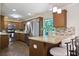 Well-lit kitchen features stainless steel appliances, tile backsplash, and breakfast bar with seating at 2383 Edgewater Sw Dr, Atlanta, GA 30311