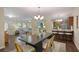 Inviting living room boasts an open floor plan with a dining area, seamlessly connecting living spaces at 2383 Edgewater Sw Dr, Atlanta, GA 30311