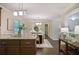 Open floor plan featuring a dining area visible from a modern kitchen with natural light at 2383 Edgewater Sw Dr, Atlanta, GA 30311