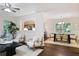 Bright living room flows into the dining area, featuring hardwood floors and lots of natural light at 2383 Edgewater Sw Dr, Atlanta, GA 30311