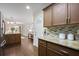 Updated kitchen features granite counters and stainless appliances that flows into the inviting living area at 2383 Edgewater Sw Dr, Atlanta, GA 30311