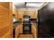 Galley kitchen features stainless steel appliances, and wooden cabinets at 2479 Peachtree Ne Rd # 605, Atlanta, GA 30305