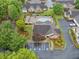 Aerial view of a community clubhouse and pool with lounge chairs, tables and manicured landscaping at 4512 Orchard Trce, Roswell, GA 30076