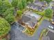 Aerial view of a community clubhouse and pool with lounge chairs, tables and manicured landscaping at 4512 Orchard Trce, Roswell, GA 30076