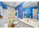 This bathroom has colorful decor, a tub/shower, and a single sink at 4512 Orchard Trce, Roswell, GA 30076