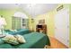 This bedroom features a vaulted ceiling, twin beds, and natural light at 4512 Orchard Trce, Roswell, GA 30076