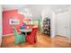 Vibrant dining room with unique furnishings, colorful accents, and plenty of natural light, adjacent to the kitchen at 4512 Orchard Trce, Roswell, GA 30076