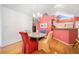 Bright dining room with colorful decor, a chandelier, and an open layout to the kitchen, perfect for Gathering dinners at 4512 Orchard Trce, Roswell, GA 30076