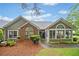 Charming one-story home with brick accents, landscaped yard, and inviting sunroom in a well-manicured neighborhood at 4512 Orchard Trce, Roswell, GA 30076