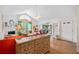 Bright living room with fireplace, adjacent sunroom and hardwood floors at 4512 Orchard Trce, Roswell, GA 30076