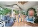 Cozy sunroom with large windows, comfortable seating, and tile floors, perfect for relaxing and enjoying the view at 4512 Orchard Trce, Roswell, GA 30076