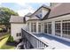 Multi-level deck overlooking backyard, showcasing outdoor living space and access to the home's interior at 9360 Nesbit Lakes Dr, Alpharetta, GA 30022