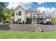 Exterior showcasing the home's backyard, deck, and stone steps at 9360 Nesbit Lakes Dr, Alpharetta, GA 30022
