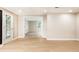 Basement with neutral walls, wood-look flooring, and walk-out access at 9360 Nesbit Lakes Dr, Alpharetta, GA 30022