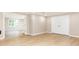 Finished basement with neutral walls, wood-look flooring, and closet space at 9360 Nesbit Lakes Dr, Alpharetta, GA 30022