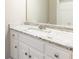 Bathroom vanity featuring a granite countertop, white cabinets, and a mirror at 9360 Nesbit Lakes Dr, Alpharetta, GA 30022