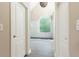 Bathroom showing tiled walk-in shower with large window and tile floors at 9360 Nesbit Lakes Dr, Alpharetta, GA 30022
