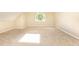 Bedroom features a window with natural light and neutral carpeting for a comfortable living space at 9360 Nesbit Lakes Dr, Alpharetta, GA 30022