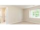 Bedroom features a window with natural light and views, creating a bright and airy space at 9360 Nesbit Lakes Dr, Alpharetta, GA 30022