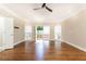 Bedroom featuring hardwood floors, a ceiling fan, and natural light at 9360 Nesbit Lakes Dr, Alpharetta, GA 30022