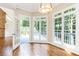 Bright breakfast nook with hardwood floors, a pendant light, and many windows offering natural light at 9360 Nesbit Lakes Dr, Alpharetta, GA 30022