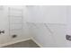 Walk-in closet featuring wire shelving and gray tile flooring at 9360 Nesbit Lakes Dr, Alpharetta, GA 30022