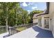 A view from the deck highlights the serene wooded surroundings, enhancing the home's connection with nature at 9360 Nesbit Lakes Dr, Alpharetta, GA 30022