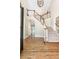Elegant foyer with hardwood floors, staircase and chandelier at 9360 Nesbit Lakes Dr, Alpharetta, GA 30022