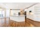 Bright kitchen with an island, stainless steel appliances, white cabinets, and hardwood floors at 9360 Nesbit Lakes Dr, Alpharetta, GA 30022