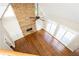 Spacious living room featuring hardwood floors, built-in cabinets and many windows at 9360 Nesbit Lakes Dr, Alpharetta, GA 30022
