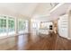 Sun-drenched living area flows to the kitchen with an open floor plan at 9360 Nesbit Lakes Dr, Alpharetta, GA 30022