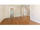 Spacious living room with hardwood floors and neutral paint at 9360 Nesbit Lakes Dr, Alpharetta, GA 30022