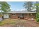 Backyard featuring a brick exterior with sliding door and patio at 1849 Clay Sw Rd, Mableton, GA 30126