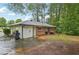 Backyard with brick exterior, a patio, and lush landscaping, ideal for outdoor relaxation at 1849 Clay Sw Rd, Mableton, GA 30126
