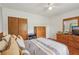Well-lit bedroom featuring hardwood floors, neutral tones, and ample closet space at 1849 Clay Sw Rd, Mableton, GA 30126